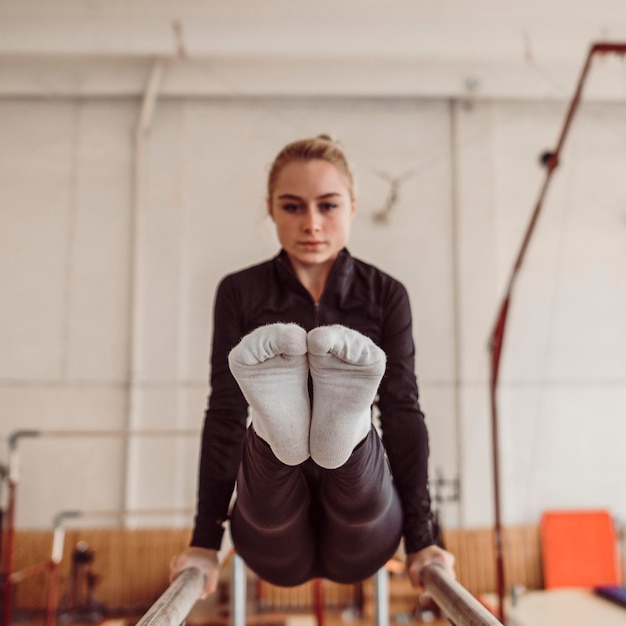 Free Photo front view woman training for gymnastics championship