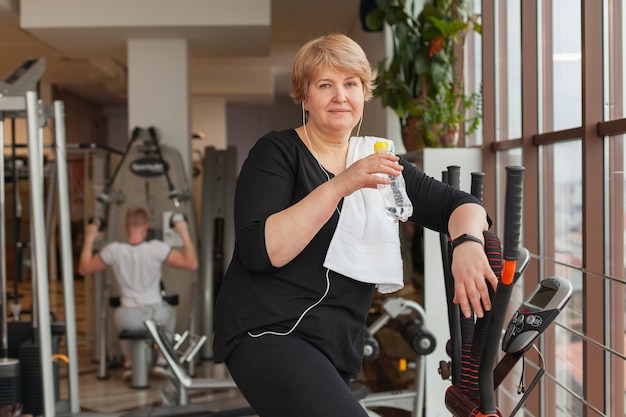 Front view woman training on treadmill