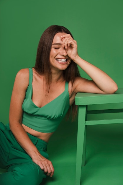 Free Photo front view woman wearing green outfit