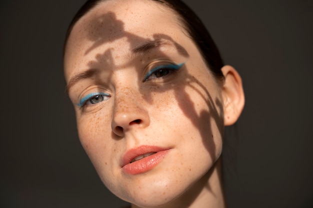 Front view woman wearing  makeup with thick eyebrows