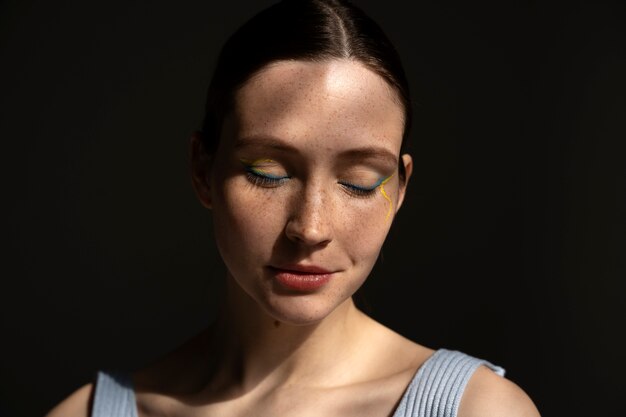 Front view woman wearing  makeup with thick eyebrows