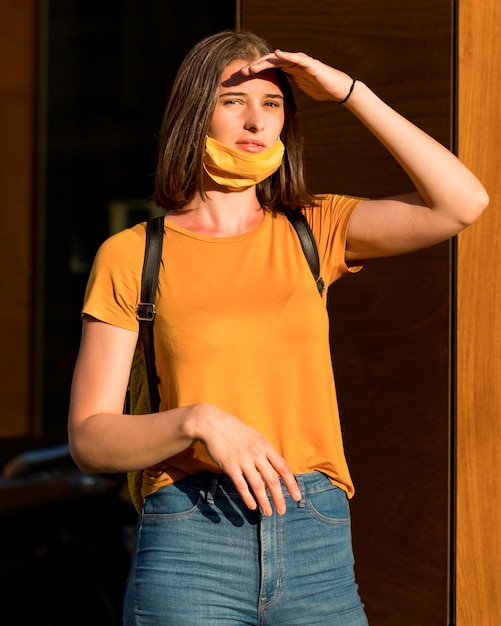 Free photo front view woman wearing mask on chin