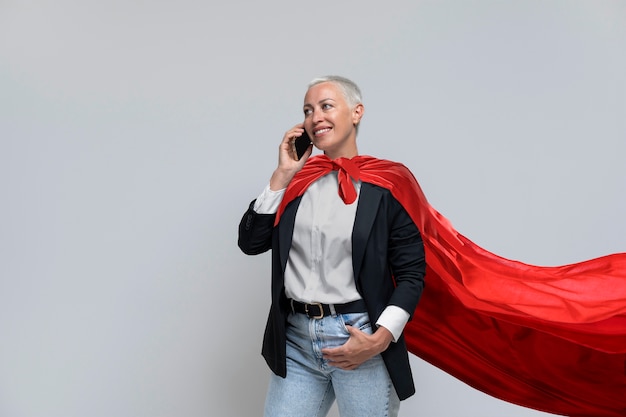 Free photo front view woman wearing red cloak