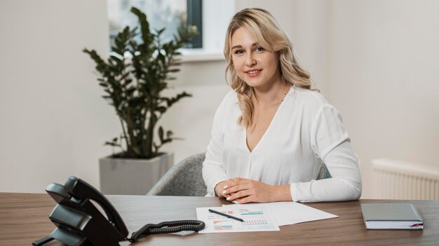 Front view woman wearing white shirt at the office