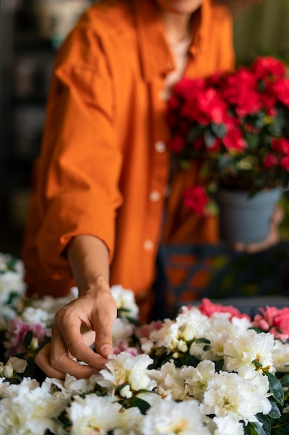 Free Photo front view woman with beautiful flowers