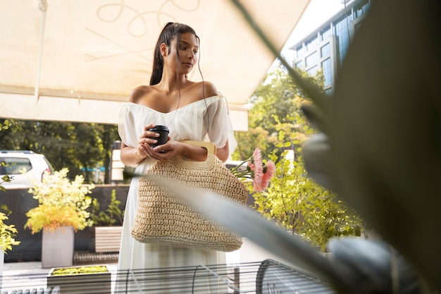 Free Photo front view woman with coffee cup