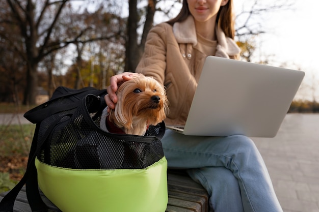 Free Photo front view woman with dog outdoors