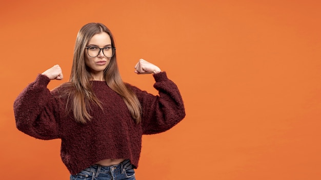 Free photo front view of woman with glasses being victorious