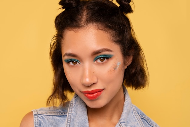 Front view woman with graphic eye makeup