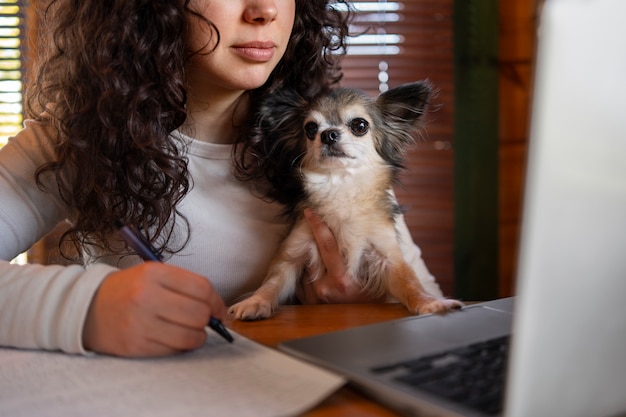 Front view woman with laptop at home