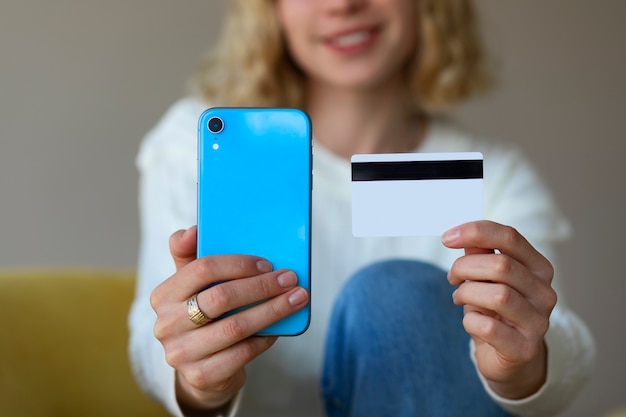 Front view woman with phone and card