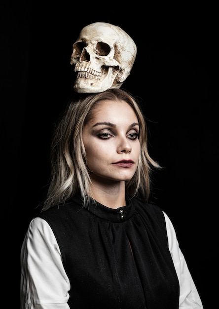 Front view of woman with skull on head