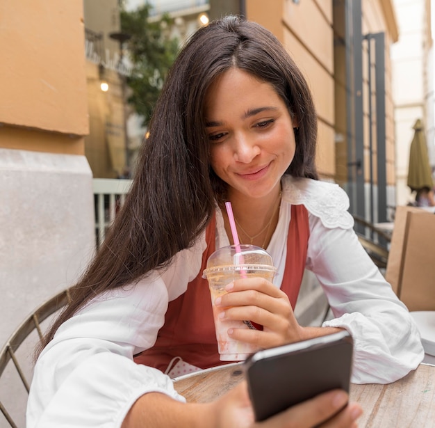 Front view of woman with smartphone