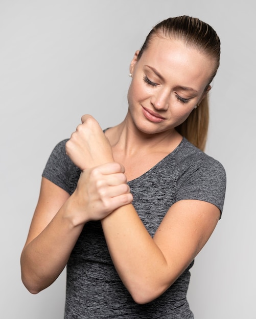 Front view of woman with wrist pain