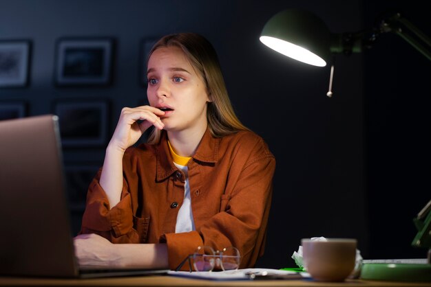 Front view of woman working from home