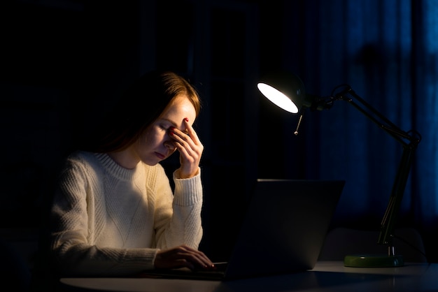 Front view of woman working on laptop