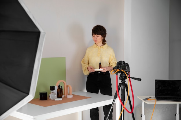 Free photo front view woman working in photography studio