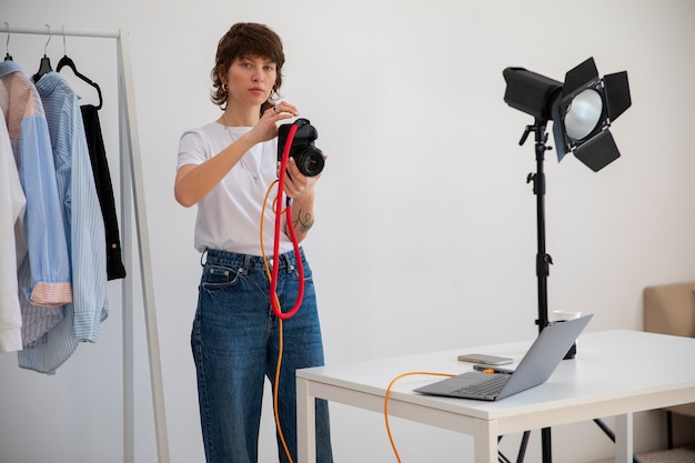 Free Photo front view woman working in photography studio