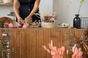 Free photo front view woman working with flowers