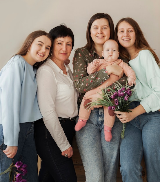 Front view women holding a baby