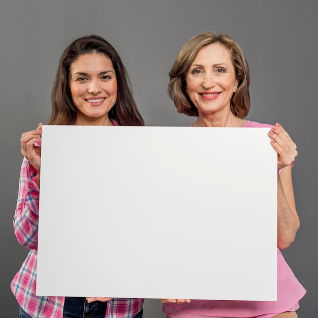 Front view womens holding blank paper sheet