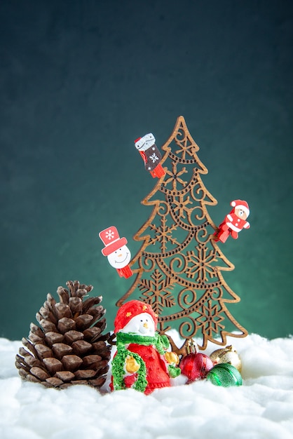 Front view wooden xmas tree with toys pinecone