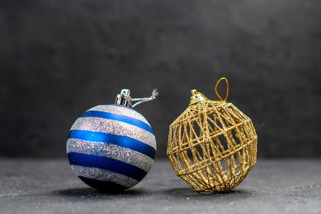 Front view xmas tree balls on dark isolated background free space