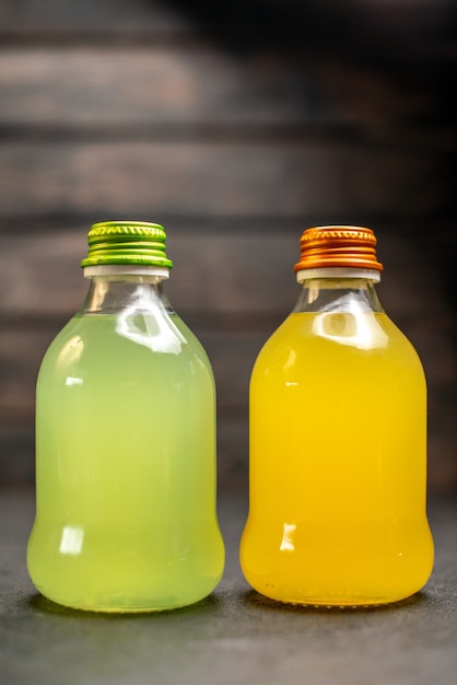 Free photo front view yellow and orange juice