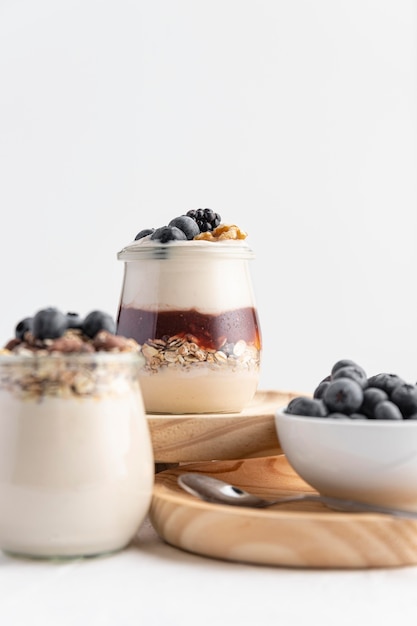 Front view yogurt mix with fruits, jam and oats