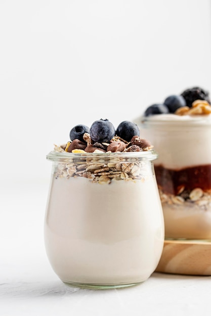 Front view yogurt with fruits and oats