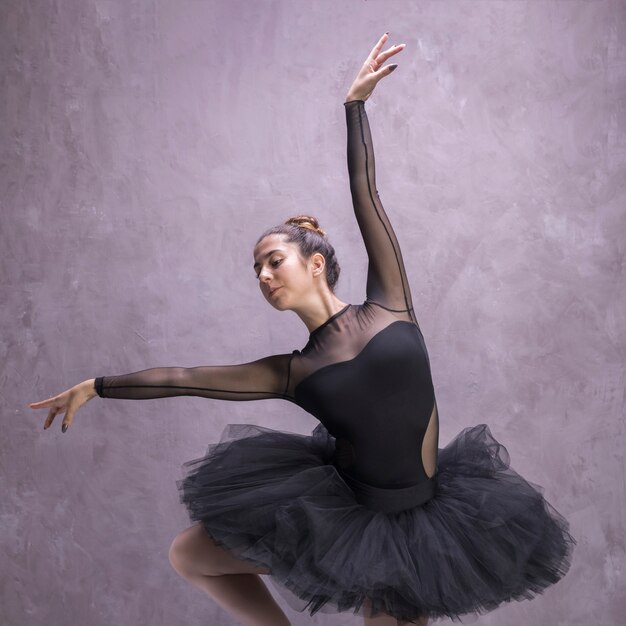 Front view young ballerina posing