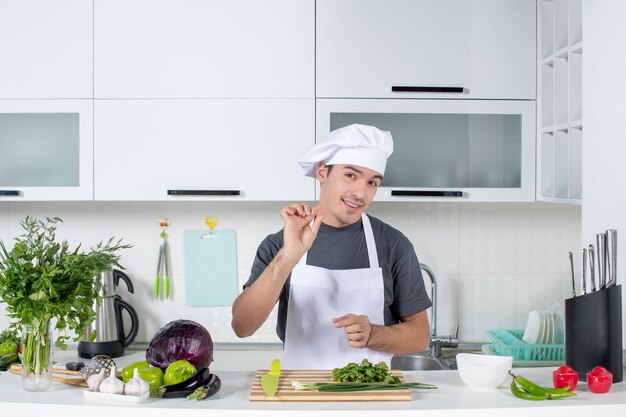 Front view young chef in cook hat