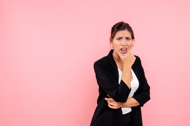 Free photo front view young female in dark jacket on a pink background