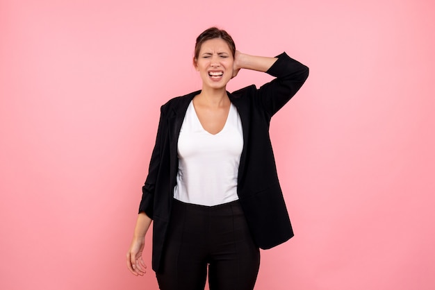 Free photo front view young female in dark jacket on pink background