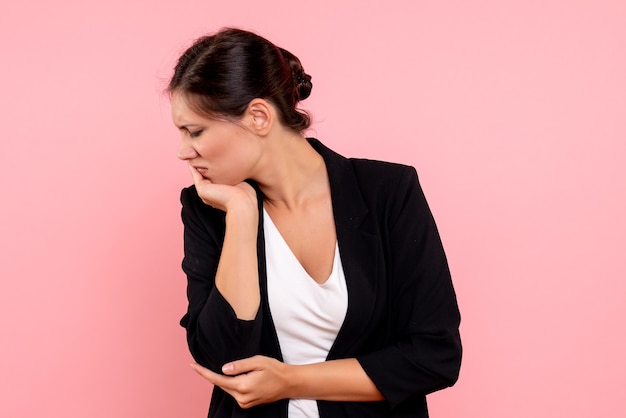 Free photo front view young female in dark jacket on pink background