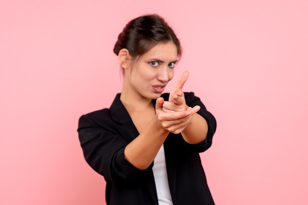 Front view young female in dark jacket on pink background