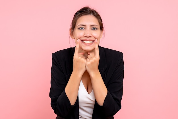 Free Photo front view young female in dark jacket on pink background