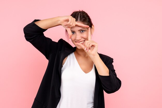 Front view young female in dark jacket on pink background