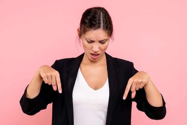 Free Photo front view young female in dark jacket on pink background