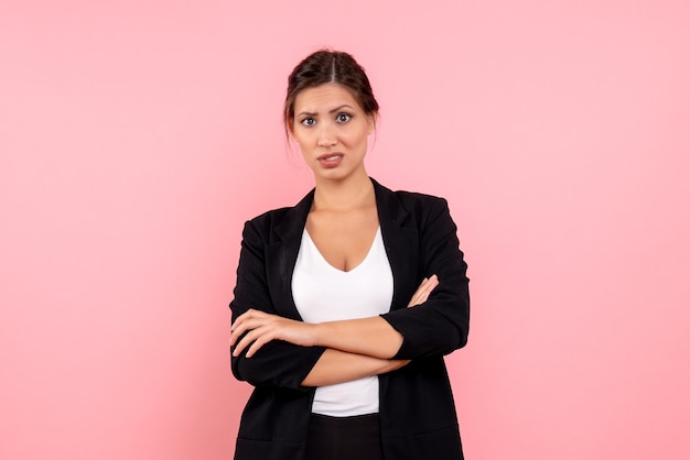 Free Photo front view young female in dark jacket on pink background