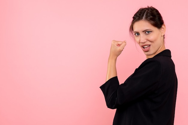 Free photo front view young female in dark jacket on pink background