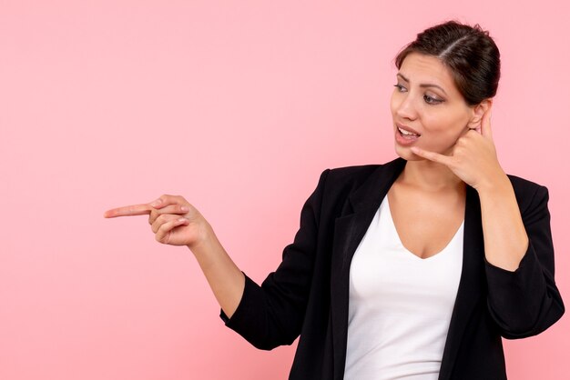 Front view young female in dark jacket on pink background