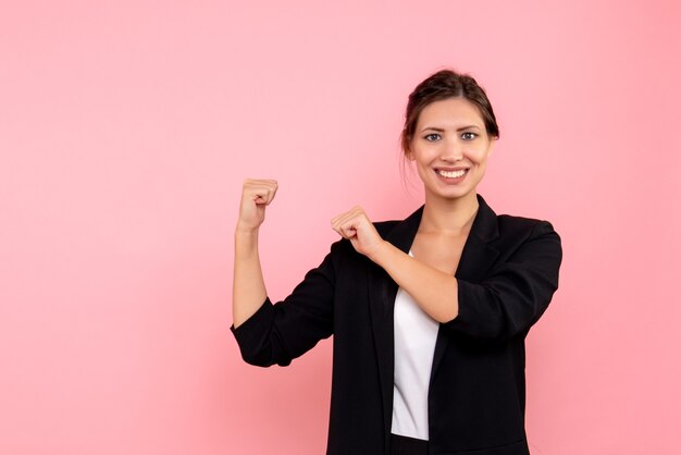 Front view young female in dark jacket on pink background