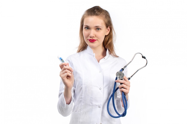 A front view young female doctor in white medical suit with stethoscope on the white