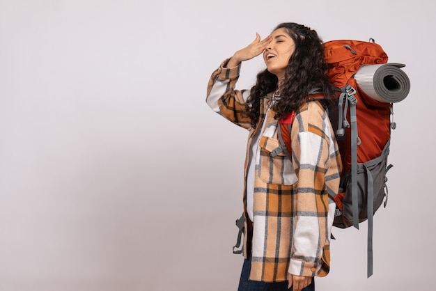 Front view young female going in hiking on white background forest nature air mountain height tourist