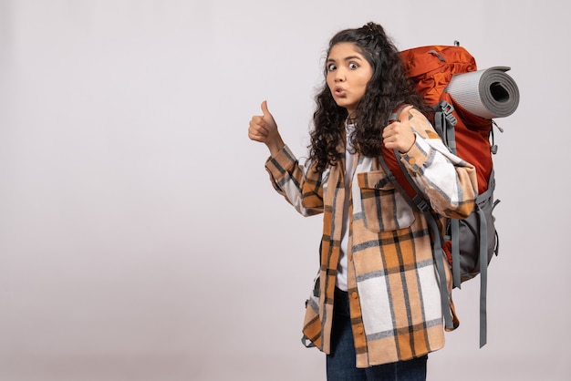 Front view young female going in hiking with backpack on white background campus vacation mountain forest air tourist