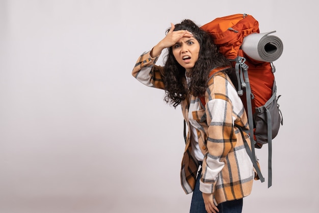 Front view young female going in hiking with backpack on white background campus vacation mountain trip forest air tourist