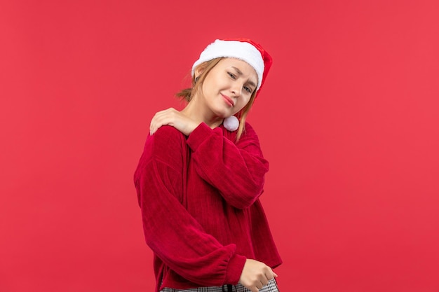 Free photo front view young female having backache, holiday christmas red