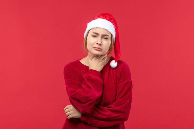 Front view young female having sore throat, holiday red christmas