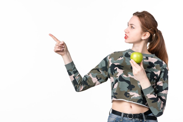 Free photo front view young female holding green apple white background juice horizontal fruit diet healthcare human skin